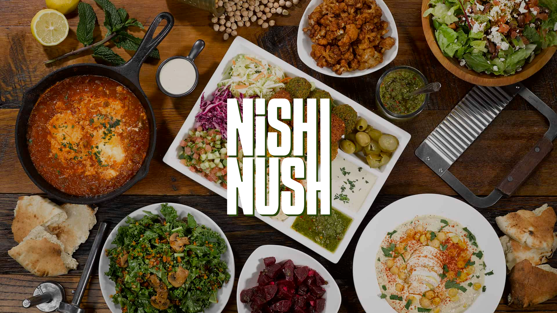 Anders brand wordmark in white placed on top of an image of a modern interior design.